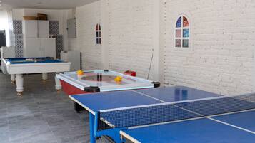 Enjoy a game of ping pong or pool in this spacious room with a ping pong table and pool table.