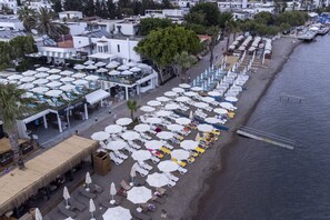 Private beach, white sand, free beach shuttle, sun loungers