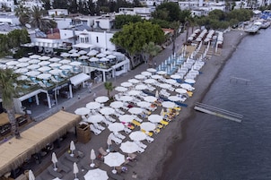 Private beach, white sand, free beach shuttle, sun loungers