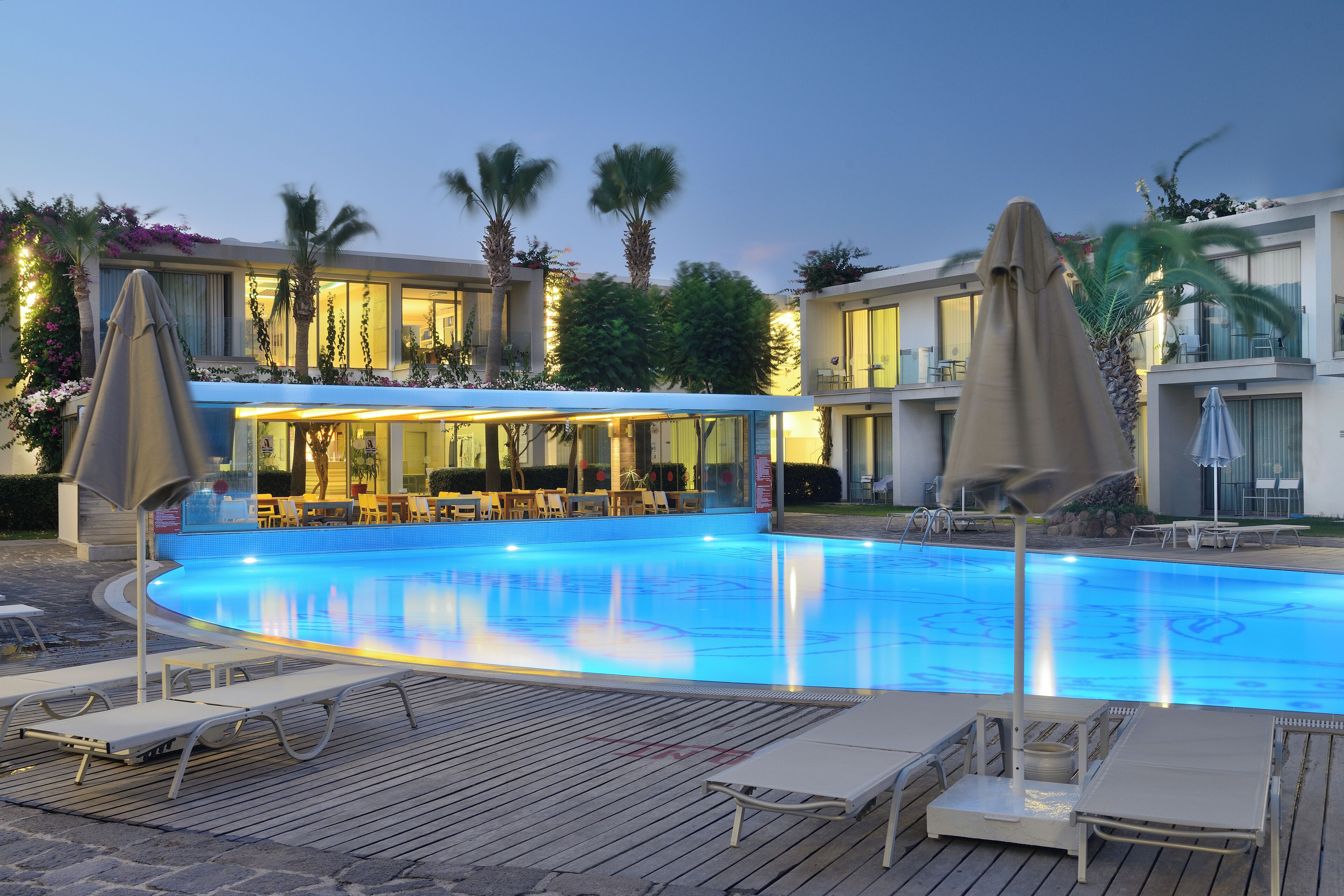 outdoor pool, pool umbrellas, pool loungers