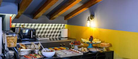 A breakfast buffet with various food items and a microwave.