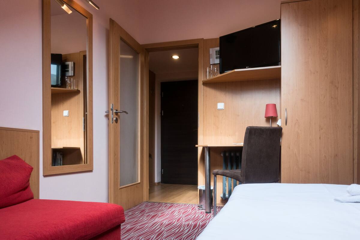 Desk, blackout curtains, free WiFi, bed sheets