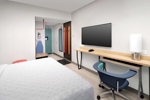 Ropa de cama de alta calidad y caja de seguridad en la habitación 