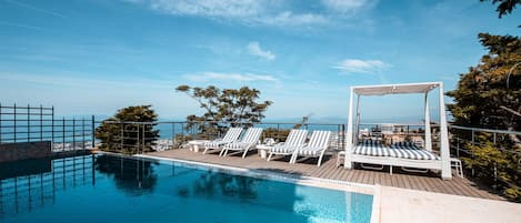 Outdoor pool, pool umbrellas, pool loungers