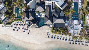 Private beach, white sand, sun loungers, beach umbrellas