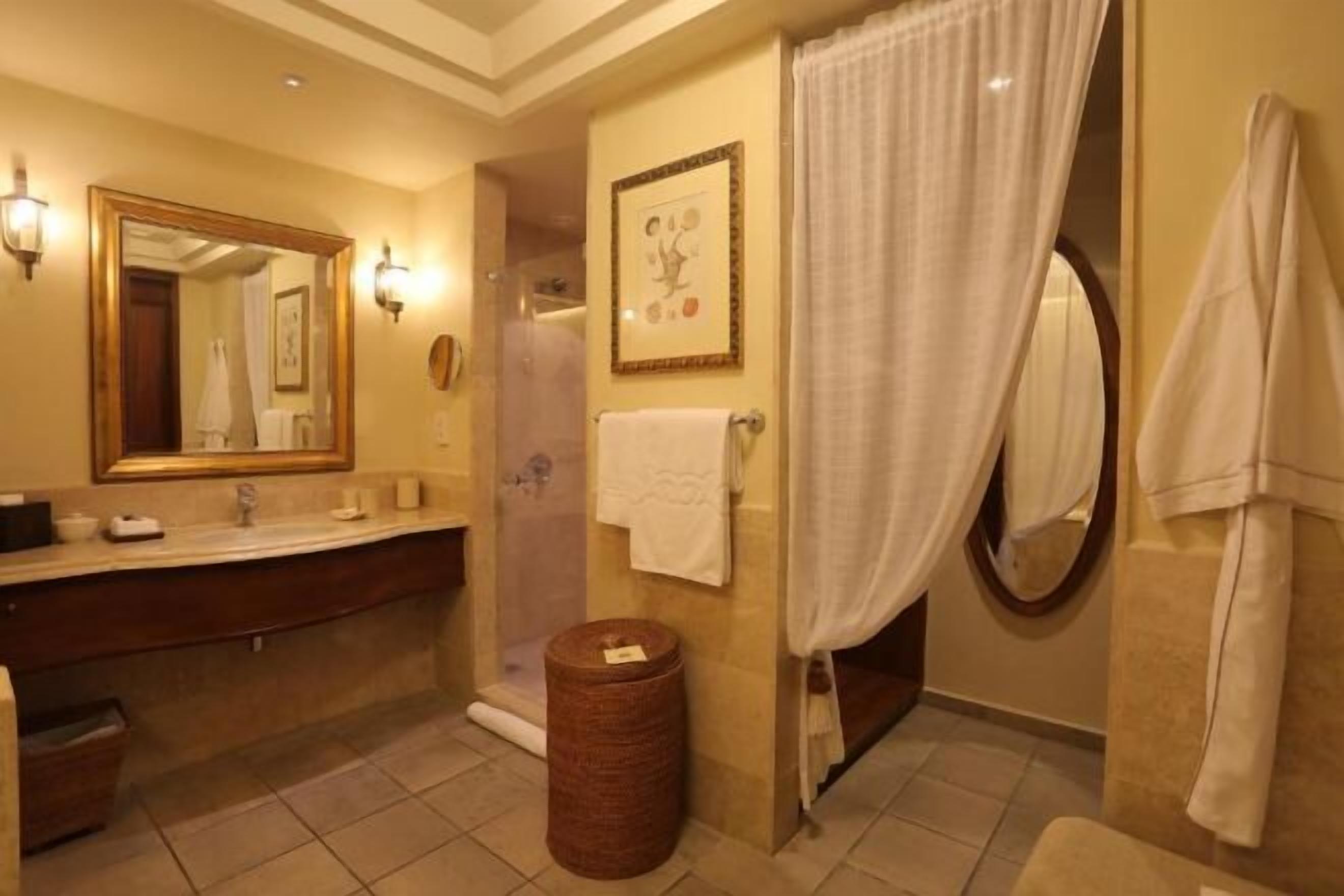 Shower, eco-friendly toiletries, hair dryer, bathrobes