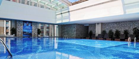 Indoor pool, pool loungers, lifeguards on site