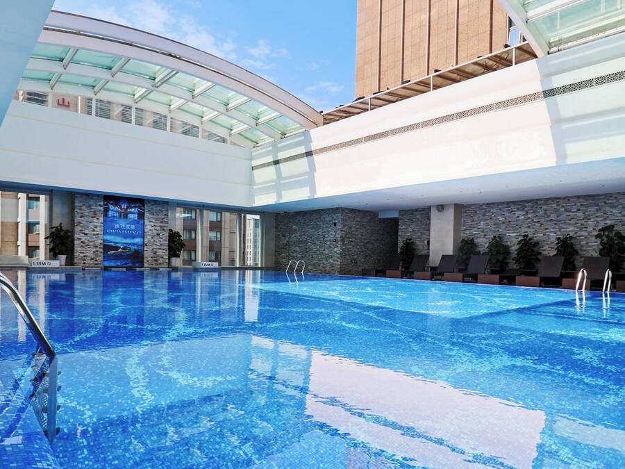 Indoor pool, pool loungers, lifeguards on site