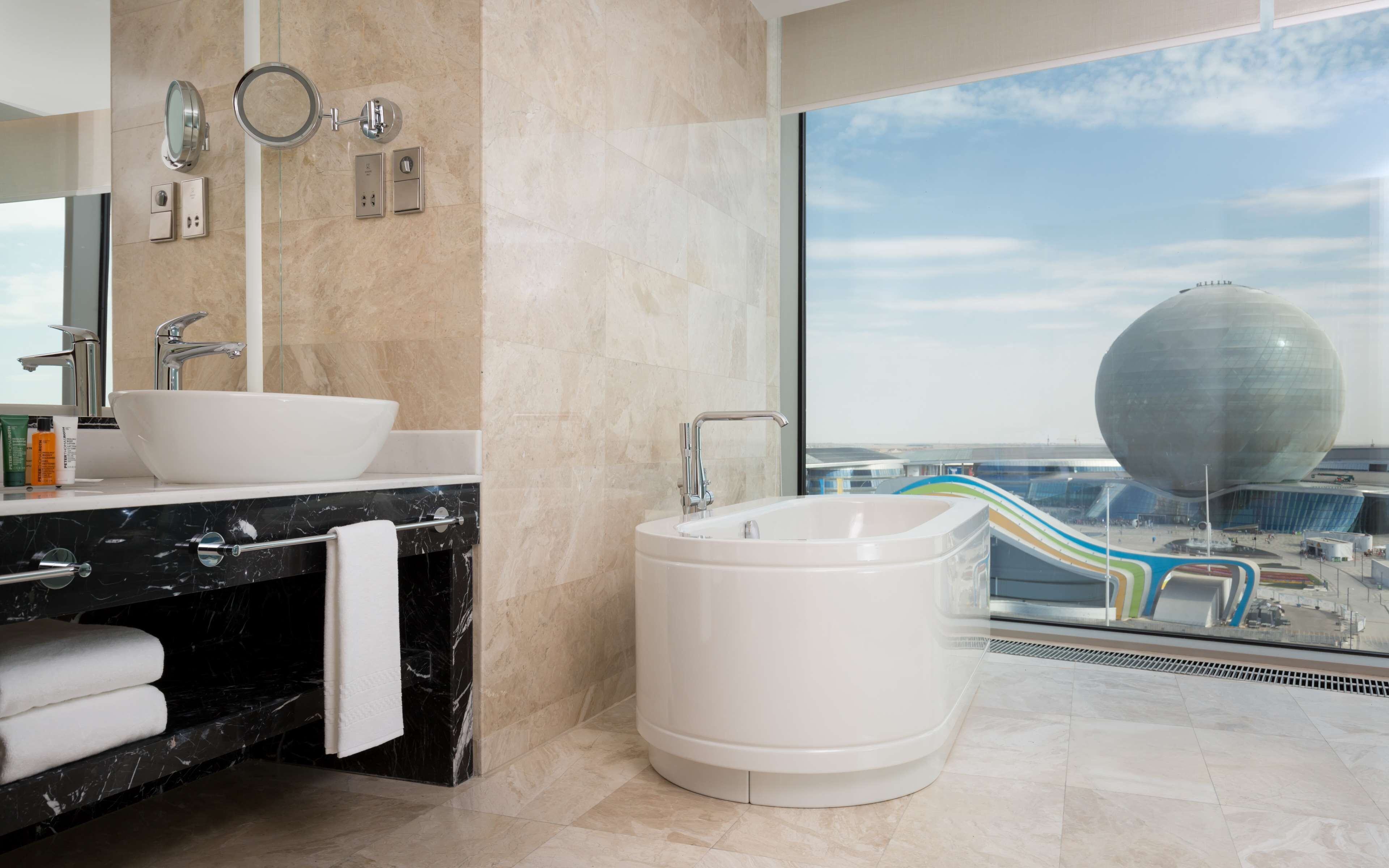 deluxe suite, 1 bedroom | bathroom | separate bathtub and shower, deep-soaking bathtub, rainfall showerhead