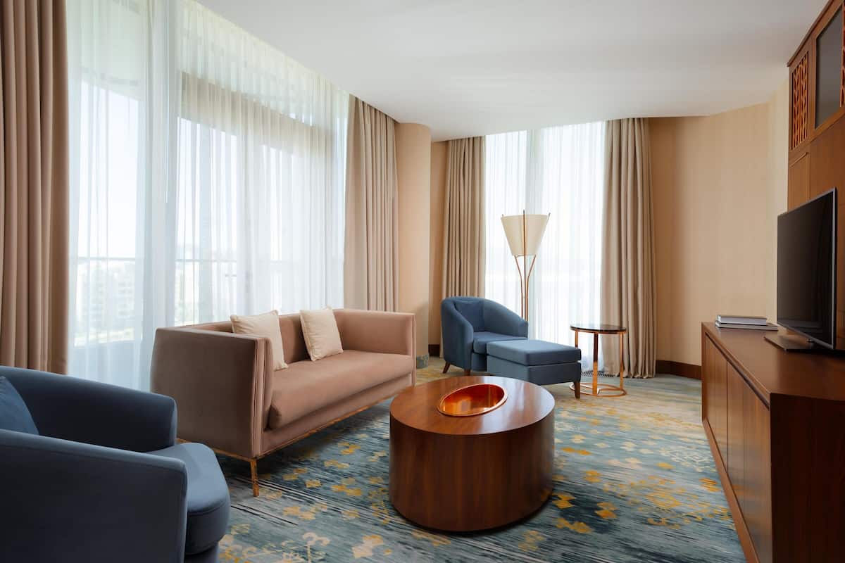 Deluxe Suite, 1 Bedroom | Living area | 40-inch Smart TV with digital channels, TV, MP3 dock