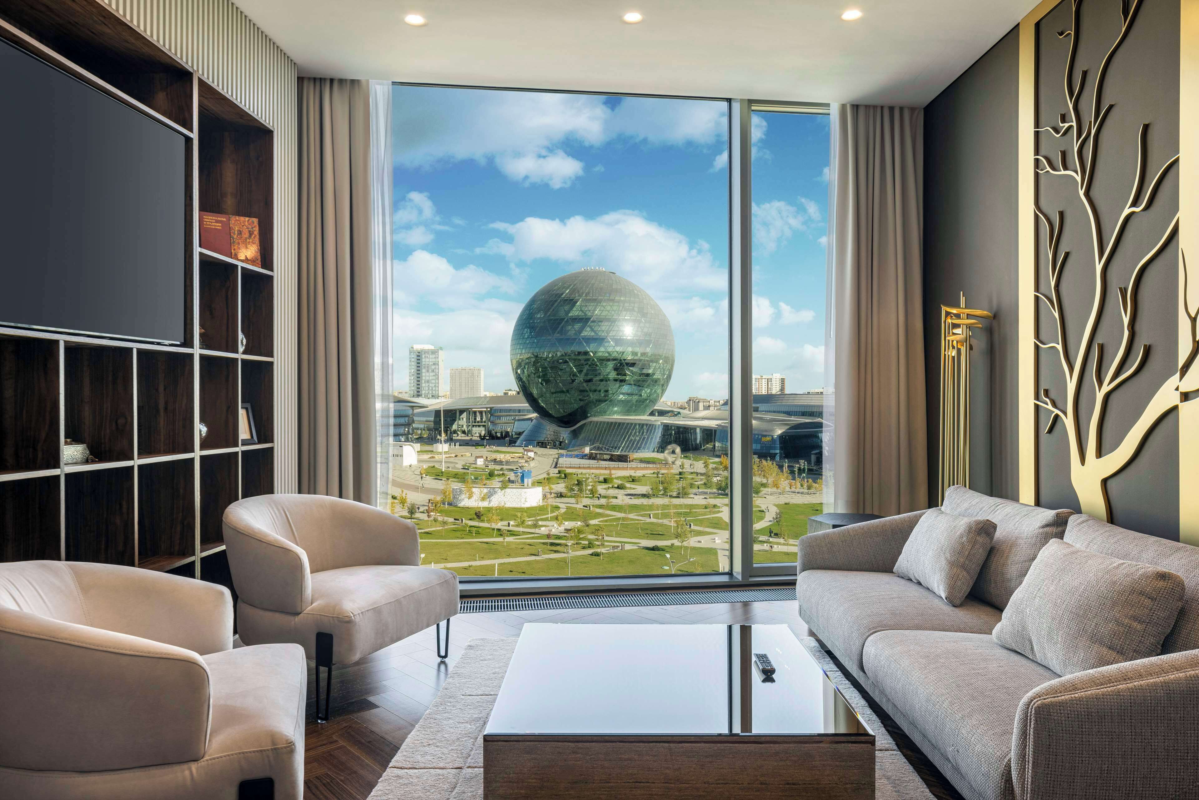 junior suite, 1 king bed | living area | 40-inch smart tv with digital channels, tv, mp3 dock