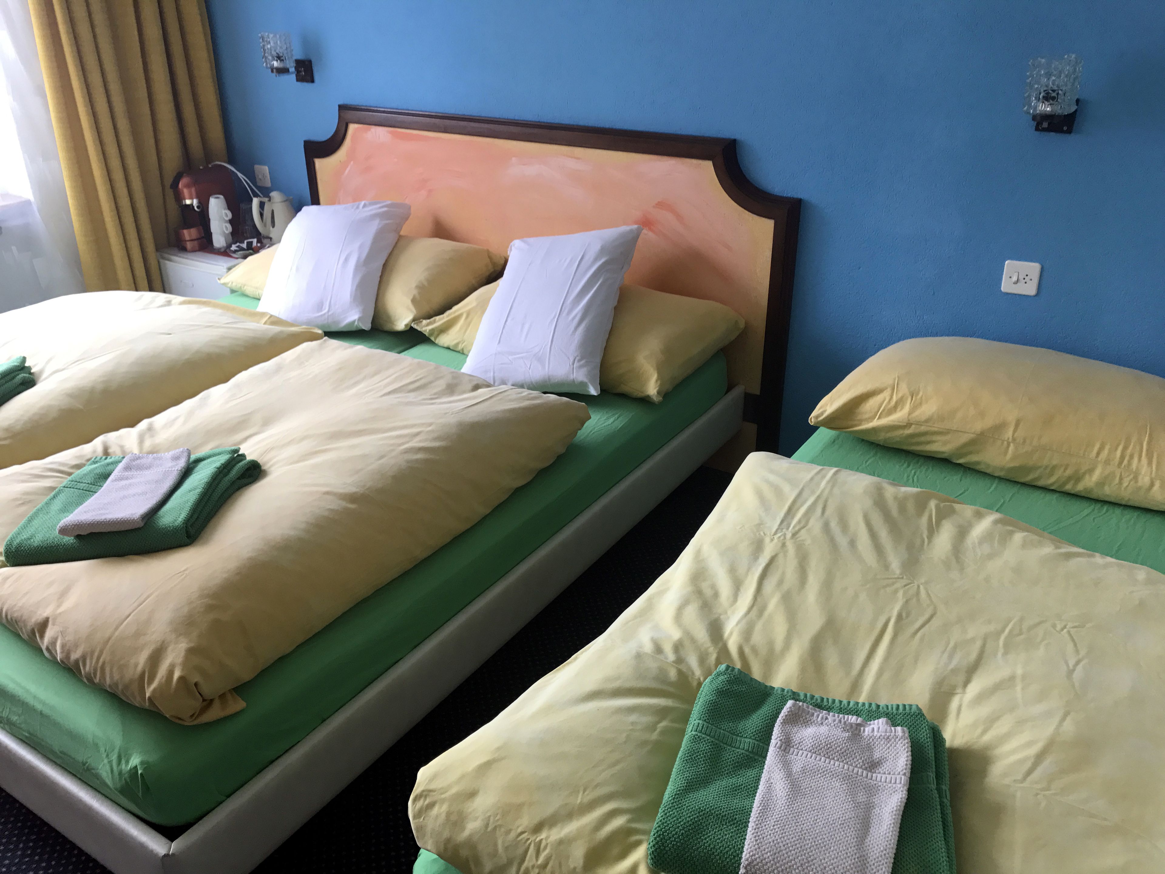 economy triple room, garden view | frette italian sheets, premium bedding, select comfort beds, minibar