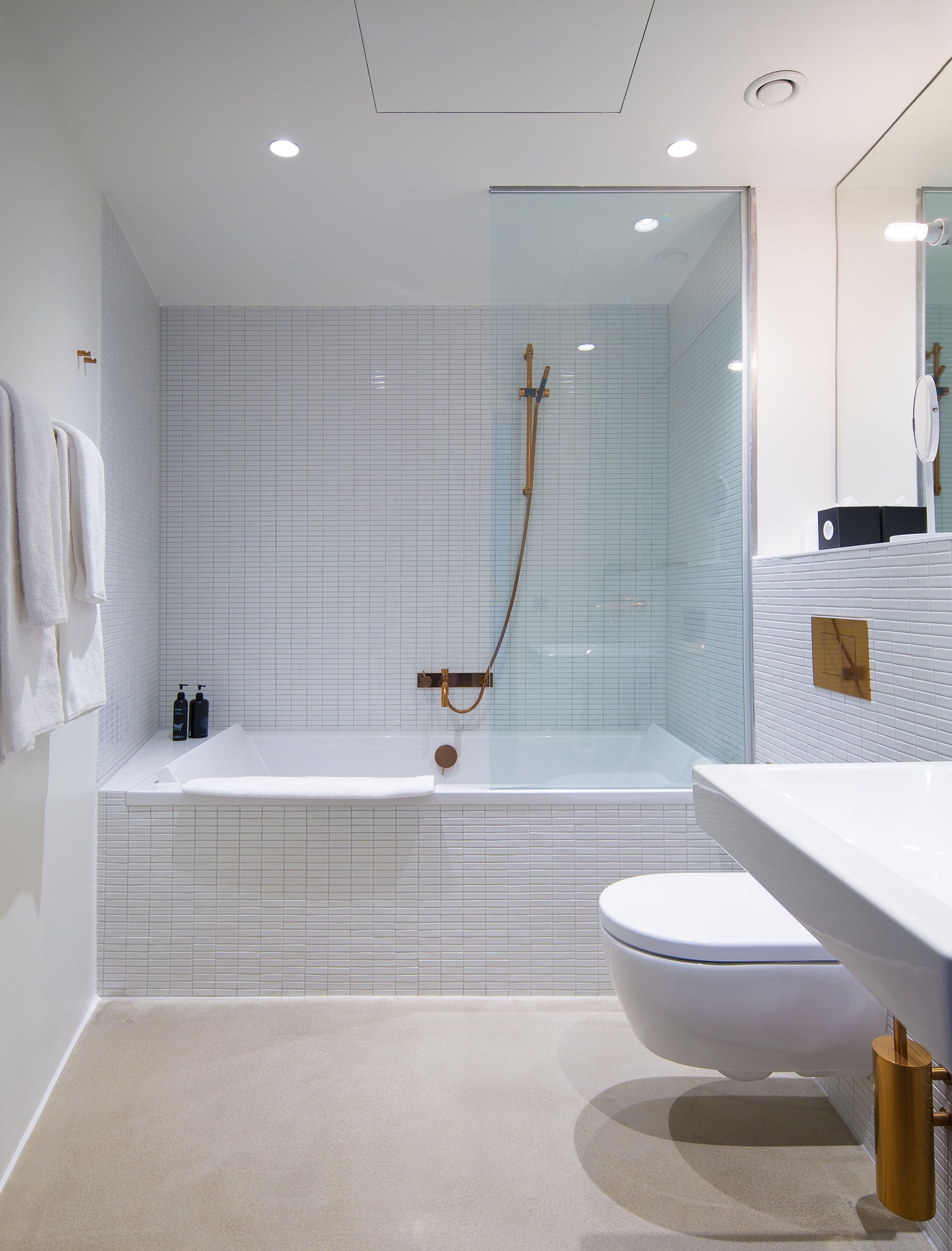 shower, designer toiletries, hair dryer, towels