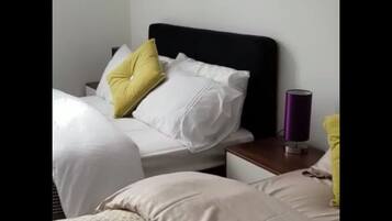 1 bedroom, premium bedding, blackout curtains, iron/ironing board