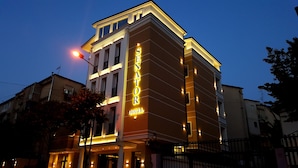 A hotel with a prominent sign reading "SENATOR HOTEL". - Senator Hotel (Tirana)