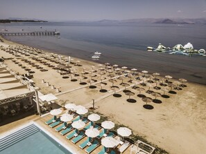 On the beach, sun loungers, beach umbrellas