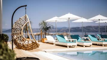 Outdoor pool, pool umbrellas, sun loungers
