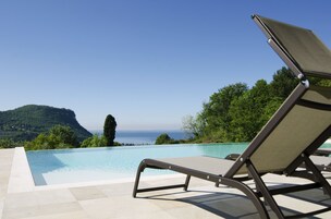 Outdoor pool, pool umbrellas, sun loungers