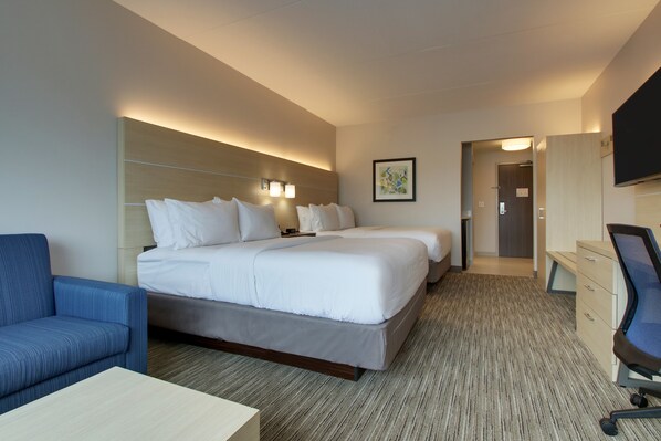 A hotel room with a large bed, a desk, a chair, and a television. - Holiday Inn Express and Suites-Elizabethtown North by IHG (Elizabethtown)