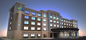 A multi-story hotel with a modern design, featuring a prominent entrance with a covered area. - Holiday Inn Express and Suites-Elizabethtown North by IHG (Elizabethtown)