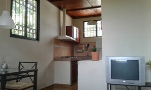 Full-sized fridge, microwave, stovetop, cookware/dishes/utensils