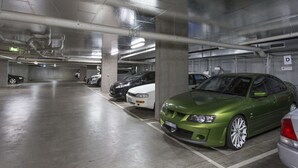 A multi-level parking garage with several cars parked. - Astra Apartments Glen Waverley at VIQI (Glen Waverley)