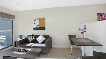 Executive Studio, 1 Bedroom | Living area | 50-inch flat-screen TV with digital channels, TV