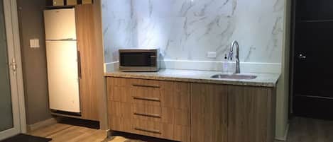 Fridge, microwave, coffee/tea maker, toaster