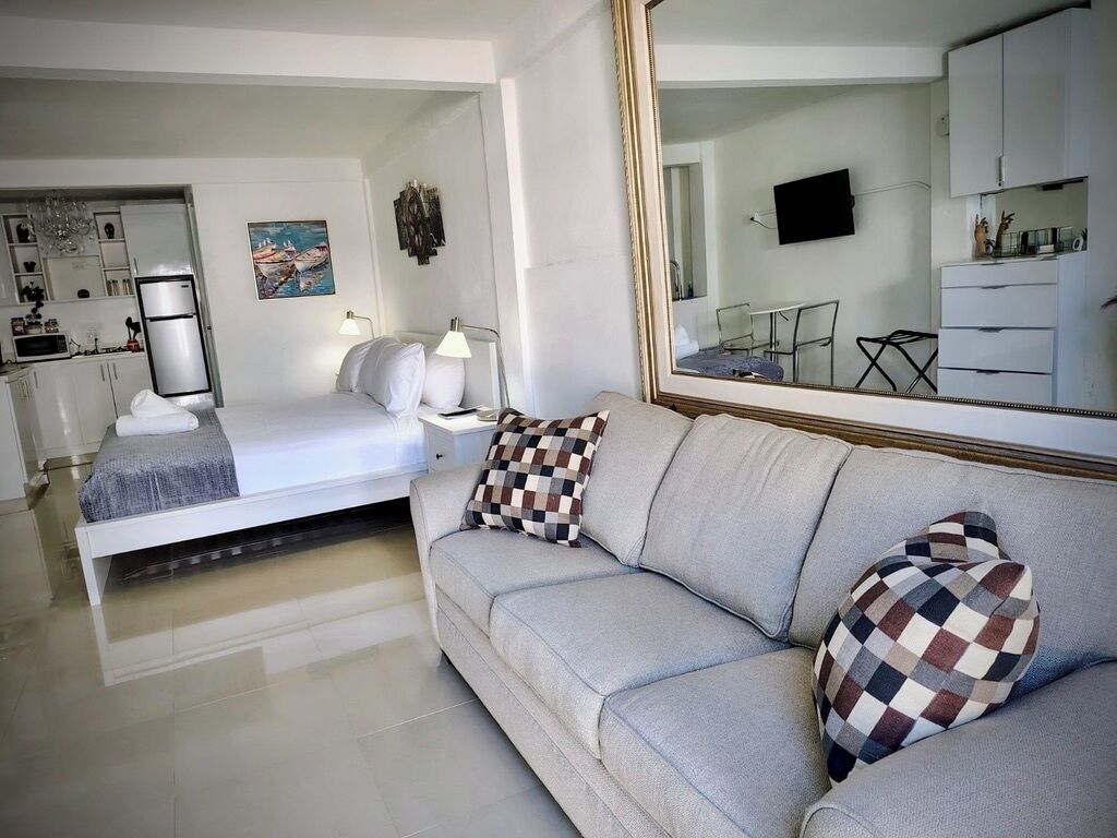 Large Studio, 1 King Bed S5 | Living area | 22-inch flat-screen TV with cable channels, TV, pay films