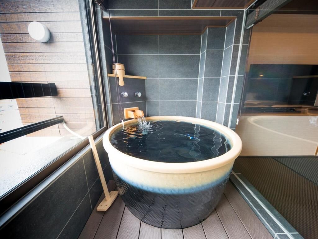 separate bathtub and shower, spring water bathtub, hair dryer, slippers