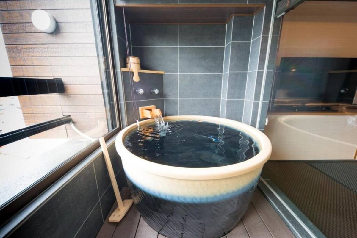 separate bathtub and shower, spring water bathtub, hair dryer, slippers