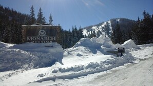 A snow-covered mountain with a sign reading "Monarch Mountain." - Ski Town Condos - Mountain Comfort in Monarch/Garfield, Colorado (Salida)