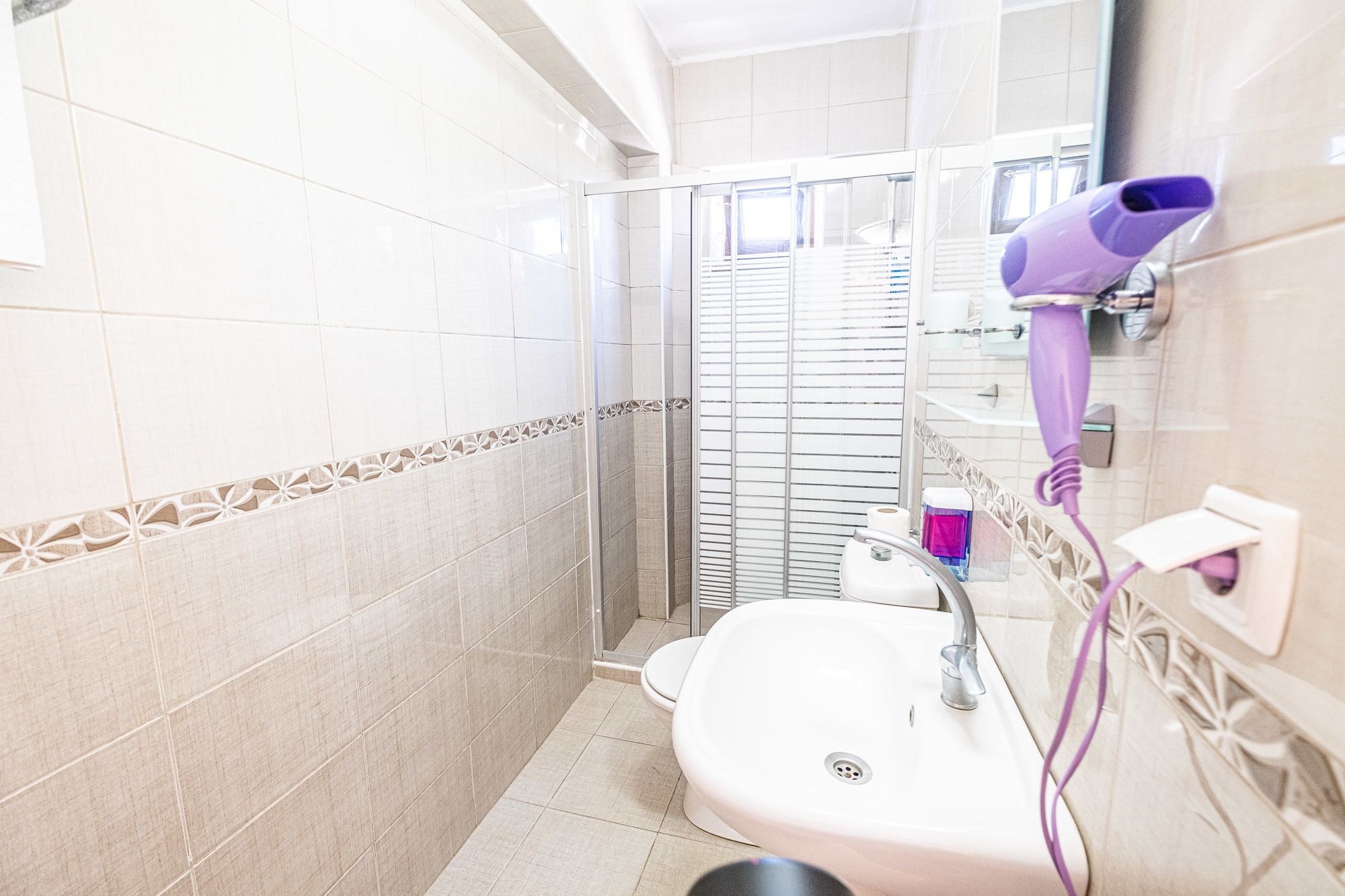 shower, free toiletries, hair dryer, slippers