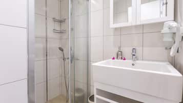 Shower, free toiletries, hair dryer, slippers