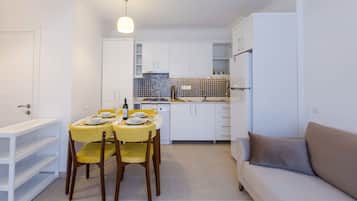 Deluxe Apartment, 1 King Bed with Sofa bed | Living area | 80-cm LCD TV with satellite channels, TV