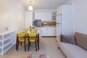 Deluxe Apartment, 1 King Bed with Sofa bed | Living area | 80-cm LCD TV with satellite channels, TV - Yenier Apart Otel (Kas)
