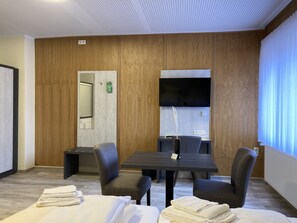 Premium Room | Living area | Flat-screen TV