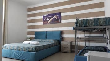 Quadruple Room | Desk, bed sheets