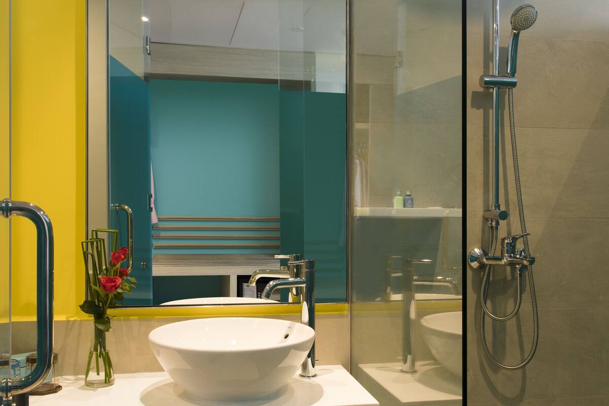 eco-friendly toiletries, hair dryer, slippers, bidet