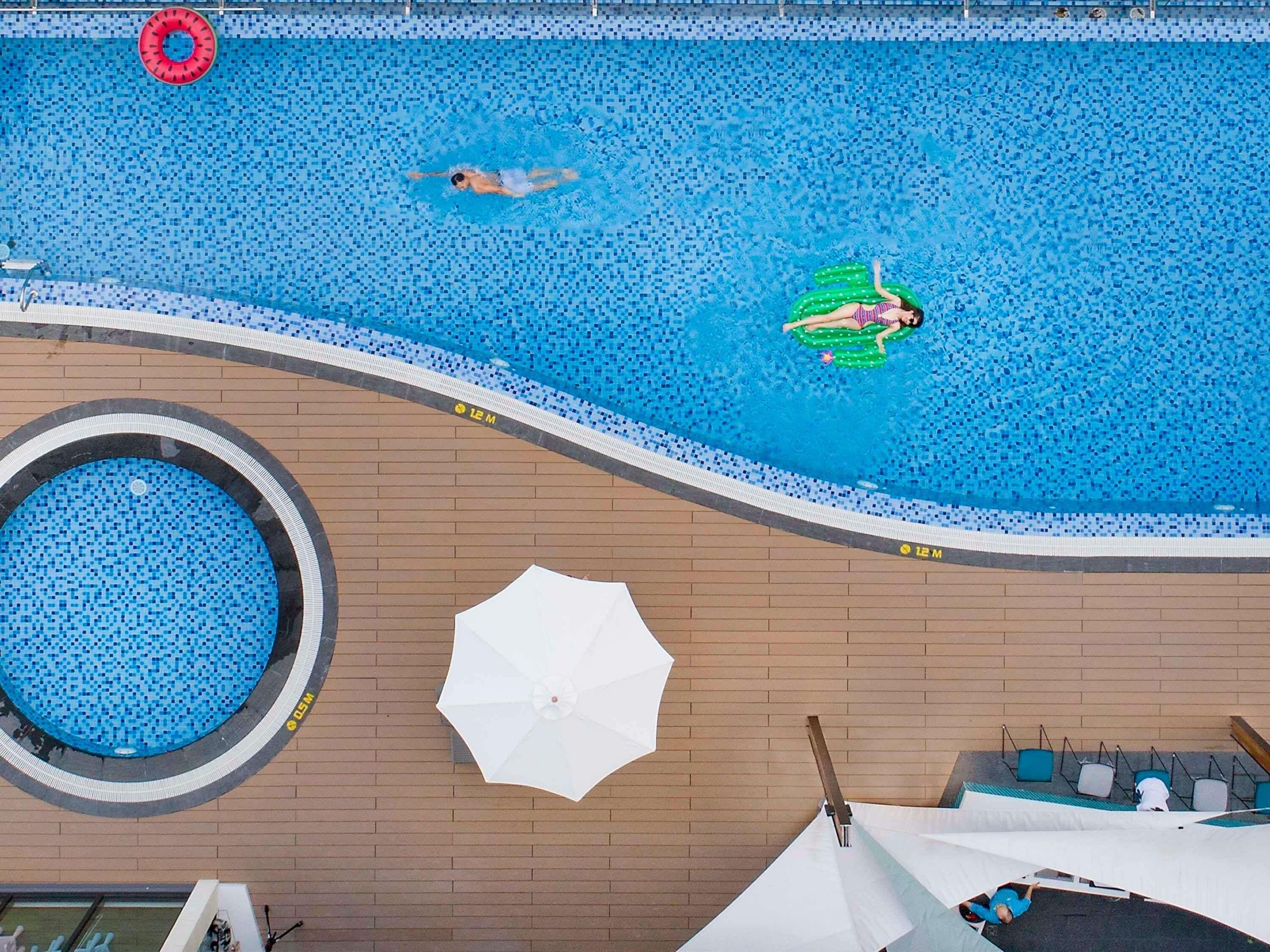 2 outdoor pools, open 6:00 AM to 6:00 PM, pool umbrellas, pool loungers