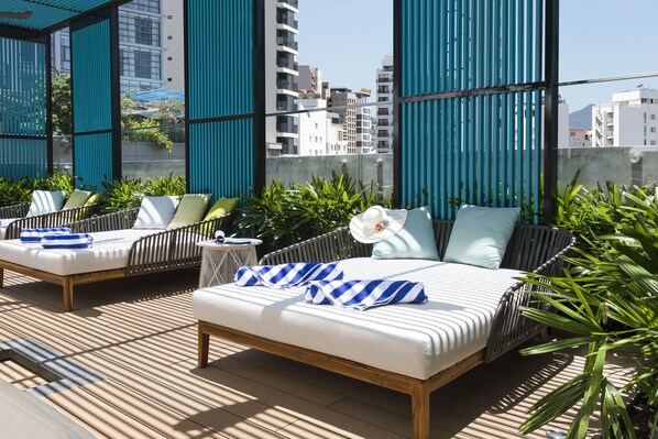 2 outdoor pools, open 6:00 AM to 6:00 PM, pool umbrellas, pool loungers