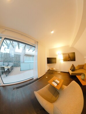 Apartamento familiar, 1 habitación (Gartenhaus 2) | Zona de estar | Una televisión de pantalla plana