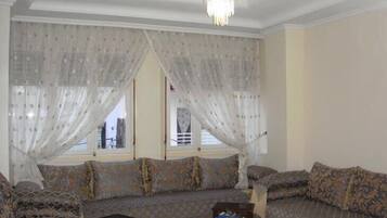 Apartment, 2 Bedrooms | Living room | Flat-screen TV