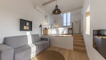 Suite junior | Sala de estar | Una televisión de pantalla plana