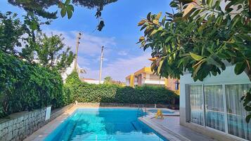Seasonal outdoor pool, open 10:00 AM to 7:00 PM, free pool cabanas