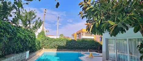 Seasonal outdoor pool, open 10:00 AM to 7:00 PM, free pool cabanas