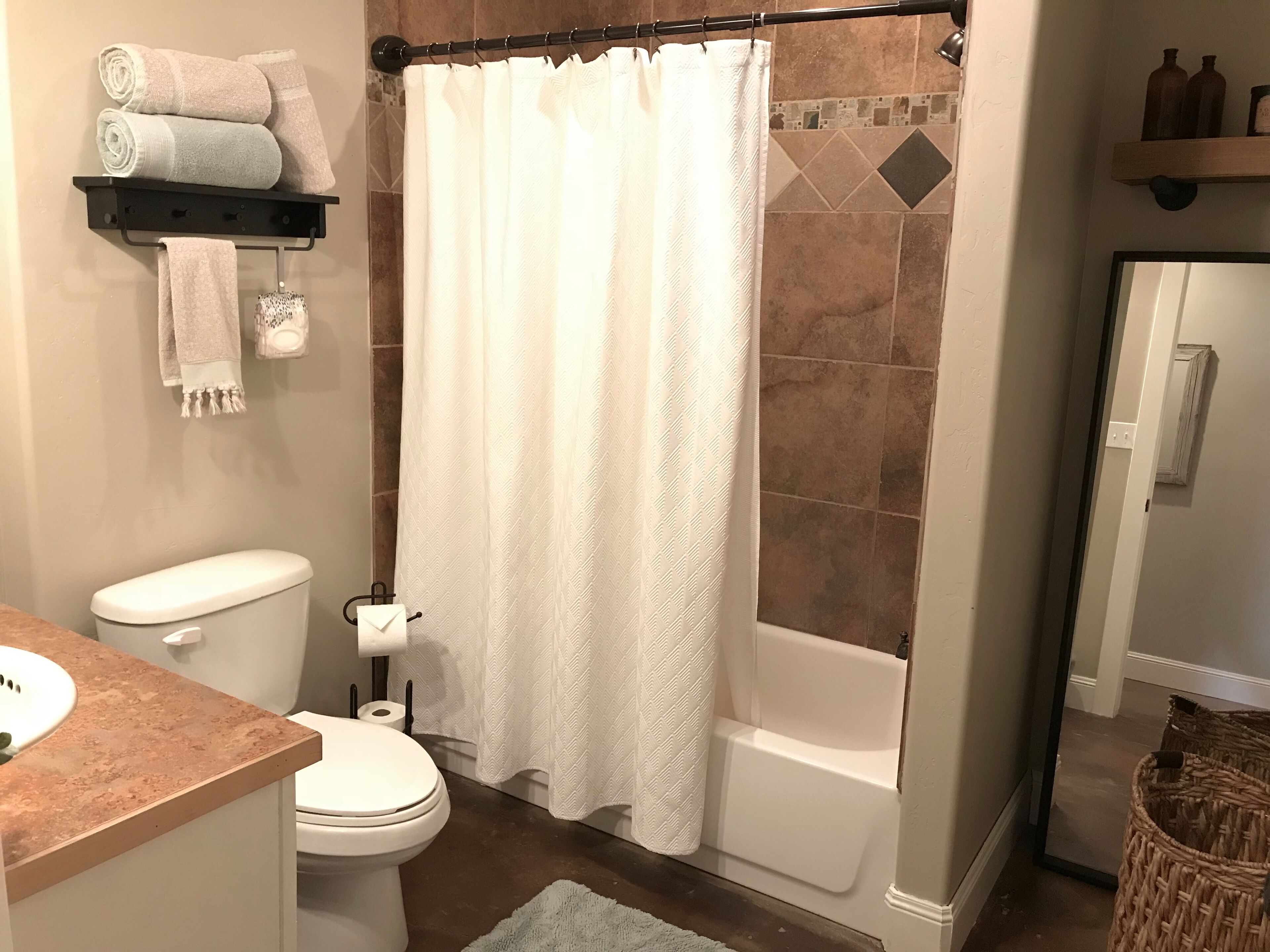 Combined shower/tub, hair dryer, towels, soap