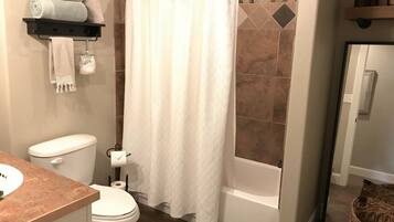 Combined shower/tub, hair dryer, towels, soap