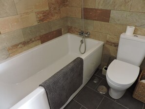 Bathtub, hair dryer, towels, soap