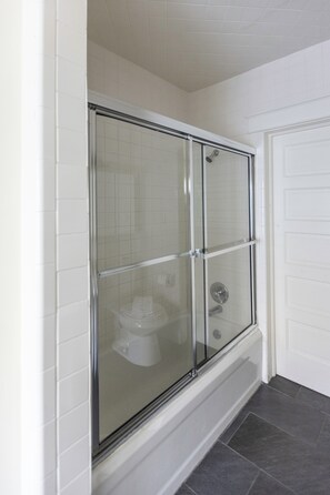Shower, hair dryer, towels, shampoo